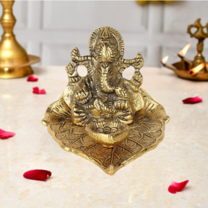 Metal Lord Ganesha Idol on Leaf with Diya 10x11 cm