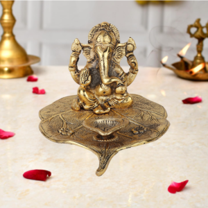 Metal Lord Ganesha Idol on Leaf with Diya 9 cm